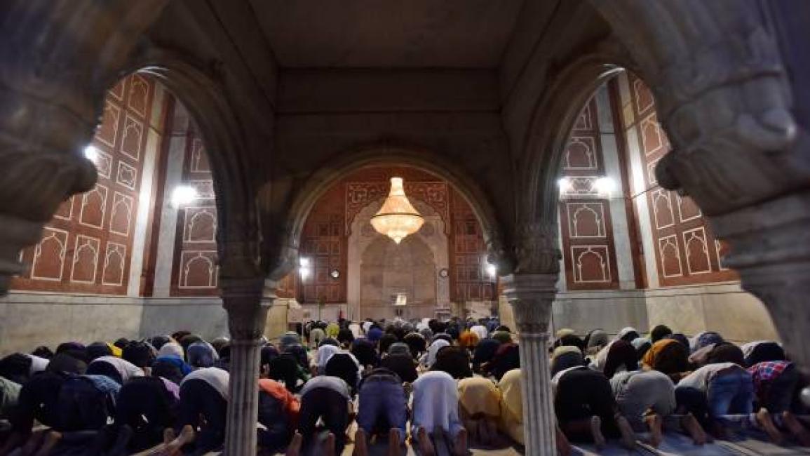 	NEW DELHI, INDIA - APRIL 14: People praying at the Jama Masjid after iftar, or the breaking of the fast, on the first day of Ramzan, on April 14, 2021 in New Delhi, India. Very much like last year, this time too, the festivities will be a bit different due to the COVID-19 pandemic. People are advised to stay inside and have to avoid stepping outside until utmost emergency during the holy month due to the virus. (Photo by Sanjeev Verma/Hindustan Times via Getty Images)