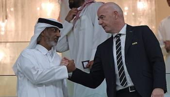 FIFA President Gianni Infantino (R) shakes hands with Qatar Football Association's president Sheikh Hamad Bin Khalifa Bin Ahmed Al-Thani during the FIFA Arab Cup 2021 group A football match between Qatar and Iraq at the Al-Bayt Stadium in the Qatari city of Al-Khor on December 6, 2021. (Photo by KARIM JAAFAR / AFP) (Photo by KARIM JAAFAR/AFP via Getty Images)