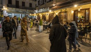 Getty-People strolling through the Small Souk Square at night...