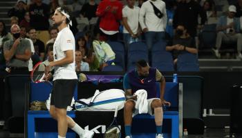 MELBOURNE, AUSTRALIA - FEBRUARY 12: Dominic Thiem of Austria (L) walks past the bench of Nick Kyrgios of Australia in their Men's Singles third round match against during day five of the 2021 Australian Open at Melbourne Park on February 12, 2021 in Melbourne, Australia. (Photo by Daniel Pockett/Getty Images)	